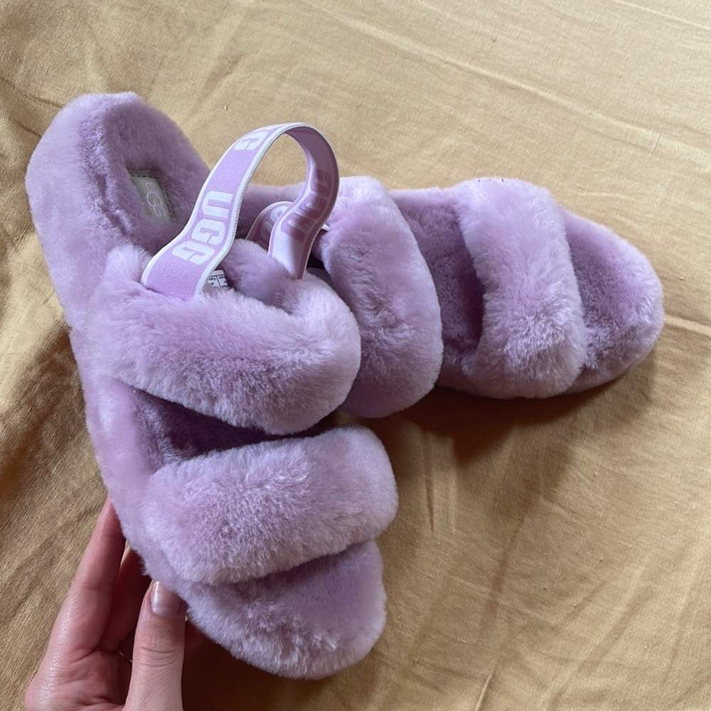 Never worn UGG slides, in size 10.